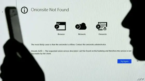 This photo illustration, shows a screen displaying the Darkside Onionsite address with a notice saying it could not be found, in Arlington, Virginia on May 14, 2021. - Servers for Darkside were taken down by unknown actors May 14, 2021, a week after the cyber extortionist forced the shutdown of a large US oil pipeline in a ransomware scam, a US cyber security firm said. (Photo by OLIVIER DOULIERY / AFP)