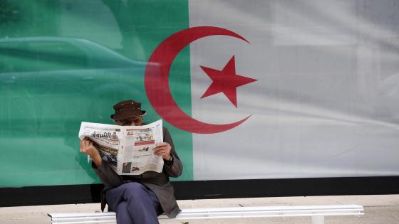 A man reads a newspaper in Algiers, Algeria, on June 7, 2020. Algeria began to resume economic and commercial activities on Sunday as part of easing the COVID-19 lockdown. Under the plan, the gradual recovery of economic, commercial and service activities will initially be implemented in two phases, with the first phase starting on June 7 and the second on June 14 (Photo by Billal Bensalem/NurPhoto)