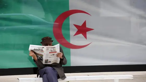 A man reads a newspaper in Algiers, Algeria, on June 7, 2020. Algeria began to resume economic and commercial activities on Sunday as part of easing the COVID-19 lockdown. Under the plan, the gradual recovery of economic, commercial and service activities will initially be implemented in two phases, with the first phase starting on June 7 and the second on June 14 (Photo by Billal Bensalem/NurPhoto)