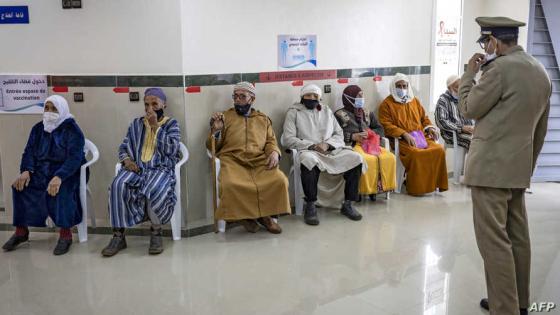 Elderly Moroccans wait their turn for the COVID-19 vaccine at an inoculation centre in the city of Sale on February 12, 2021, as part of a campaign in the region. - A country of 35 million people, Morocco has registered nearly half a million cases of the Covid-19 illness and 8,440 deaths, battering the country's economy and forcing a renewed curfew from December 23. (Photo by FADEL SENNA / AFP)