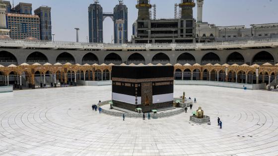 Workers at the Grand Mosque complex in Saudi Arabia's holy city of Mecca, mask-clad due to the COVID-19 coronavirus pandemic, work around the Kaaba, Islam's holiest shrine, at the centre of the complex ahead of the annual Hajj pilgrimage season on July 24, 2020. - The 2020 hajj season, which has been scaled back dramatically to include only around 1,000 Muslim pilgrims as Saudi Arabia battles a coronavirus surge, is set to begin on July 29. Some 2.5 million people from all over the world usually participate in the ritual that takes place over several days, centred on the holy city of Mecca. This year's hajj will be held under strict hygiene protocols, with access limited to pilgrims under 65 years old and without any chronic illnesses. (Photo by - / AFP) (Photo by -/AFP via Getty Images)