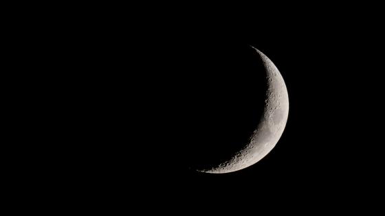 View of the crescent moon through telescope.